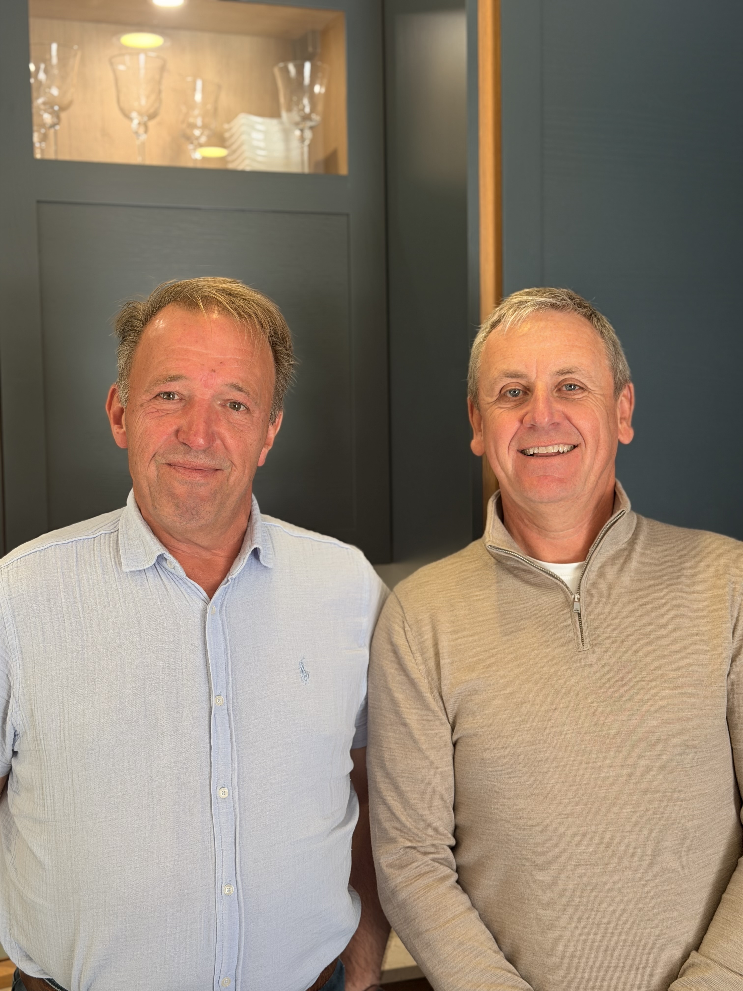 Gus Riddle and Ian Coghill, co-founders of Riddle & Coghill Interiors, in one of the studio's showroom kitchens