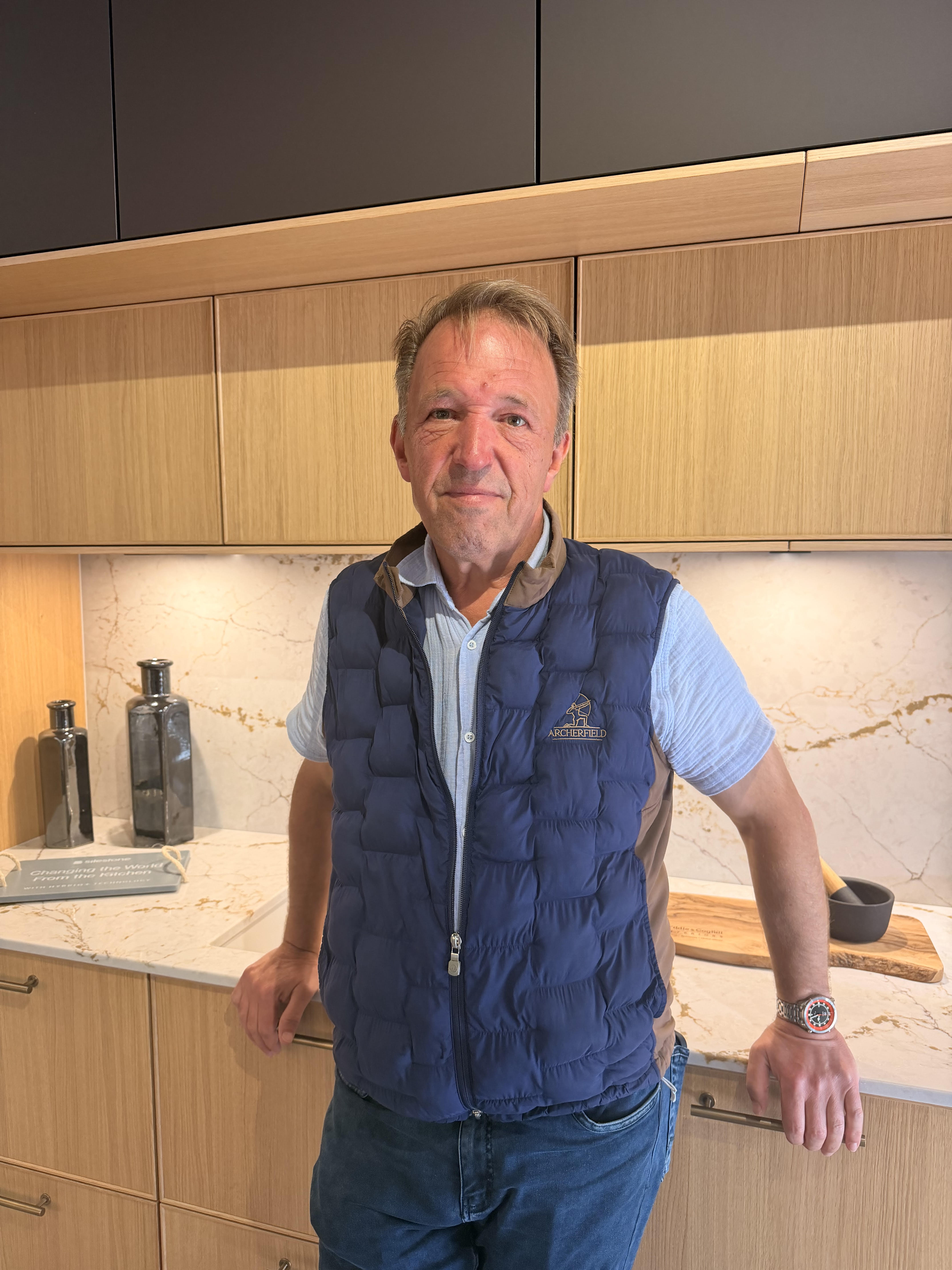 Gus Riddle, co-founder of Riddle & Coghill Interiors, in one of the studio's showroom kitchens